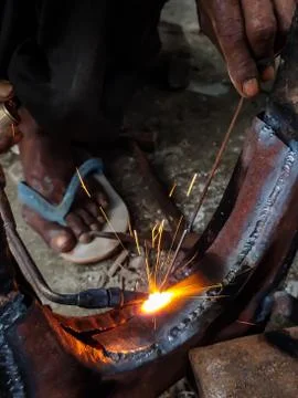 Fire sparkle generates due to welding work. Stock Photos