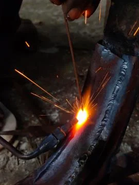 Fire sparkle generates due to welding work. Stock Photos
