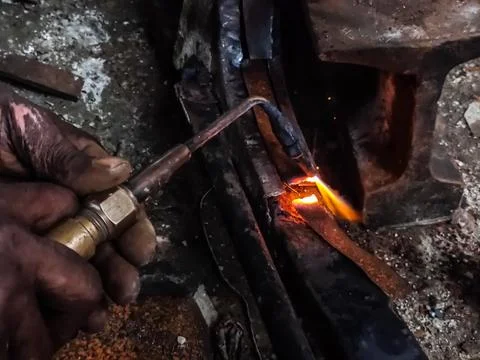 Fire sparkle generates due to welding work. Stock Photos