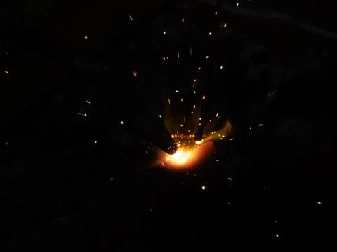 Fire sparkle generates due to welding work. Foto stock