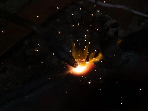 Fire sparkle generates due to welding work. Stock Photos