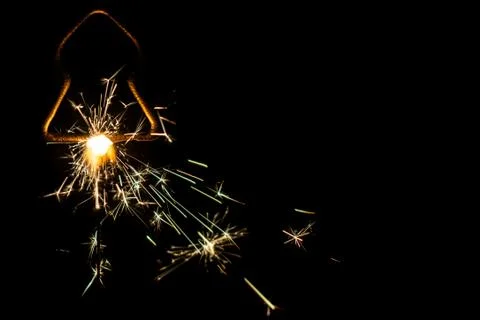 Fire sparklers on black background Stock Photos