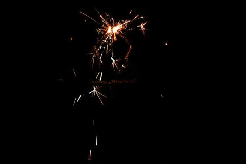 Fire sparklers on black background Stock Photos