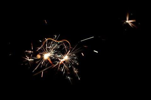 Fire sparklers on black background Stock Photos