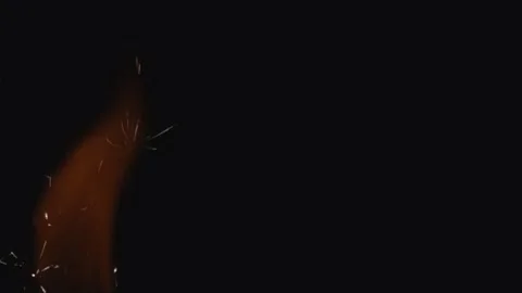 Fire sparks animation on a dark background Stock Footage 149832401