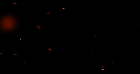 Fire sparks from campfire with ash rise over black background, danger explosion Stock Footage