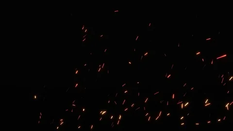 Fire sparks from campfire over black background. Loop Stock Footage 74074910