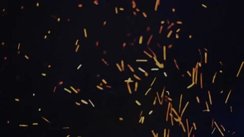 Fire sparks flying in the night sky Stock Footage 159192895