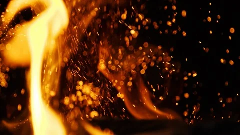 Fire sparks moving on dark at black background coming from brightly burning warm 動画素材 89799289