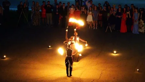 Fire specialists staged Carnival Fire show for the spectators on the square Stock Footage 73202289