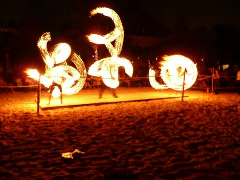 Fire Spinners Group at Night Stock Photos