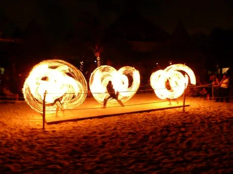 Fire Spinners Line at Night Stock Photos