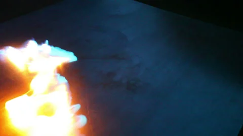 Fire spreading across reflective surface Stock-Footage 38124489