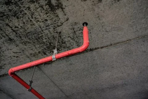 Fire sprinkler or fire extinguishing system under ceiling of building Stock Photos