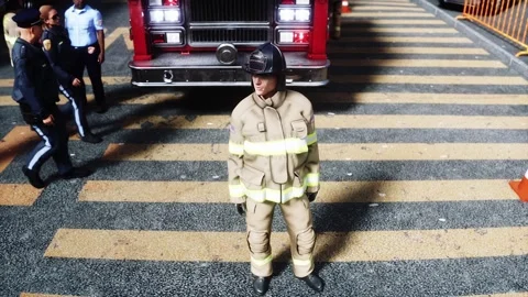 Fire station. A firefighter stands next to a fire engine. Stock Footage 333418690