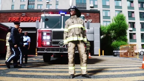 Fire station. A firefighter stands next to a fire engine. Video stock 333418692