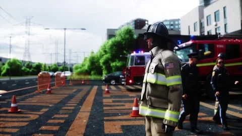 Fire station. A firefighter stands next to a fire engine. Stock Footage 333418700