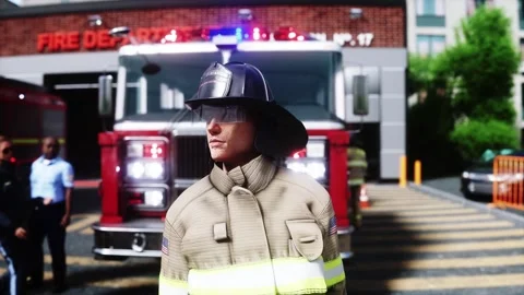 Fire station. A firefighter stands next to a fire engine. Stock Footage 333418714