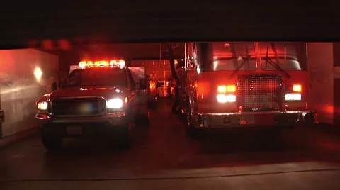 Fire Station Night View: Trucks Ready, Lights Flashing Stock Footage 8948076