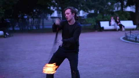 Fire street perfomance at dusk Stock Footage 250271641