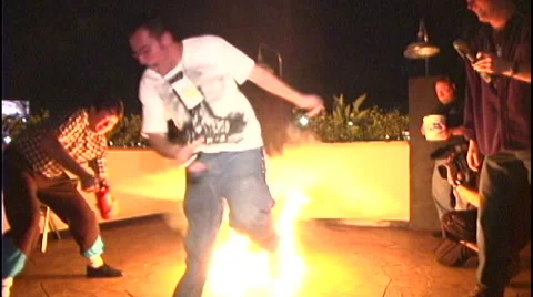 FIRE STUNT BY YOUNG MAN Stock Footage