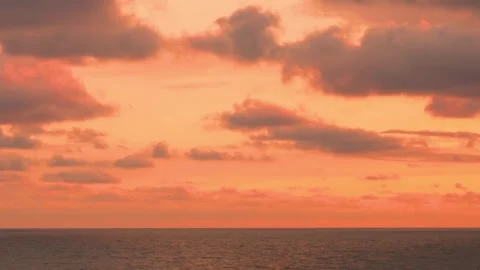 Fire sunset sea view and bright sky colorful puffy clouds in sunlight time lapse Stock Footage 334942125