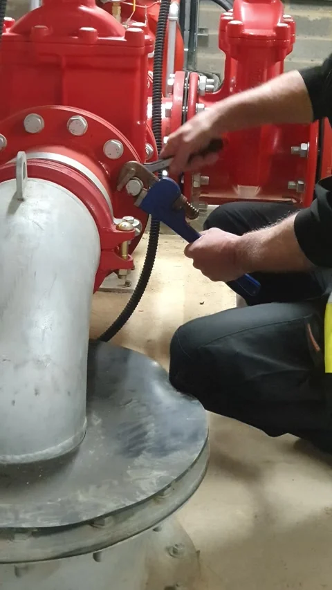 Fire system and specialist sprinkler engineer using wrench and ratchet Stock Footage 334975603