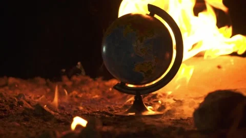 Fire takes an earth globe on cement shapes of abandoned building 스톡 동영상 144671937