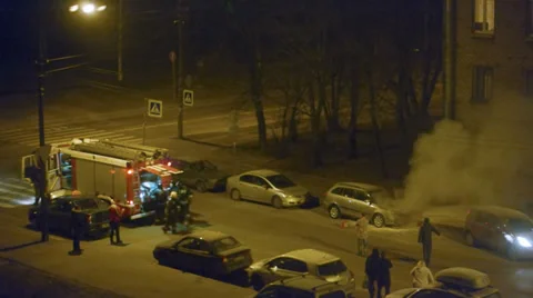 Fire team is going to put out a car Stock Footage 34989911