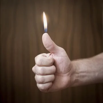 Fire &amp; Thumb Stock Photos