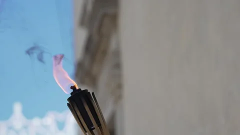 Fire torch ignited burning in the daytime Video stock 263965721