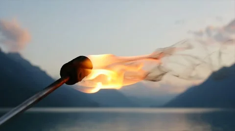 Fire torch light burning in slow motion at twilight sky Stock-Footage 42945657