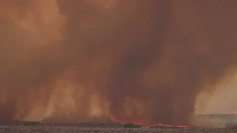 Fire Tornado with Swirling Debris Stock Footage 138487387