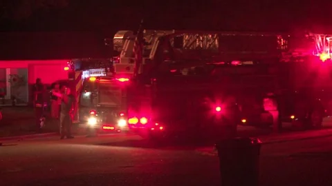 Fire Truck backing up at night Stock Footage 77575341