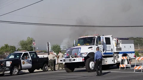 Fire truck passes through cops road block Stock Footage 114413320