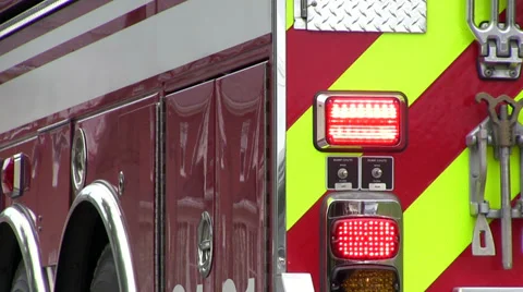 Fire truck pulls away with lights flashi... | Stock Video | Pond5