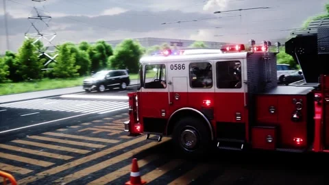 Fire truck quickly leaves for the call, garage door at fire department opens. 動画素材 333418613