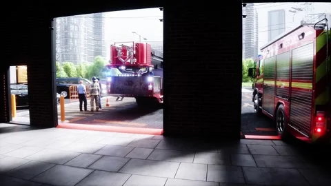 Fire truck quickly leaves for the call, garage door at fire department opens. Video stock 333418656