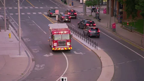 Fire Truck Responding Through Downtown Toronto Stock Footage 339631305