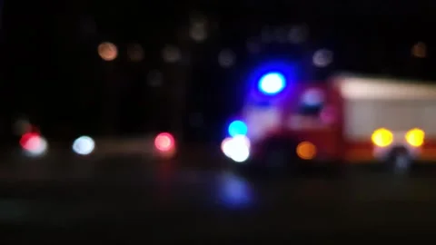 Fire truck with strobe light at night in blur. Emergency service traffic Video stock 293222624