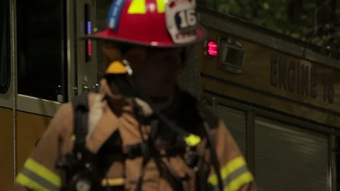 Fire Trucks and Fire Department with hoses and tools - Staged Portrayal Stock Footage 104098341