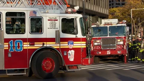 Fire Trucks and Fireman in Front of building. Fire Engine and Truck deployment Video stock 147965082