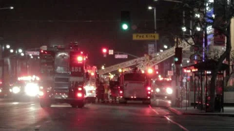 Fire trucks block street with ladders extended Video stock 10736645