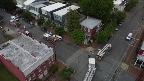 Fire trucks pulling away from a scene in downtown richmond Видео 240212504