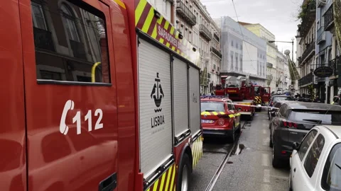 Fire Trucks Responding to Emergency in Busy Lisbon Street, Handheld Shot Stock-Footage 295146541