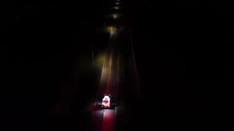 Fire trucks on road with lighting lantern at night. Aerial tracking shot Stock Footage 312023305