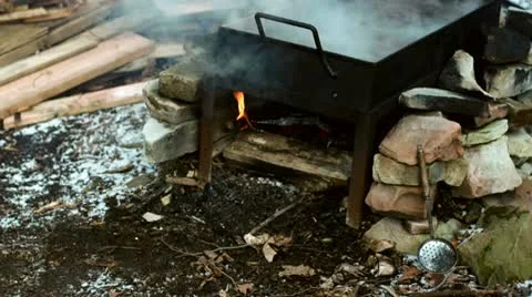 Fire under evaporation Pan HD Stock Footage 10808399
