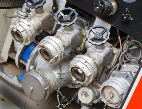 Fire valves at the rear of a fire engine Stock Photos