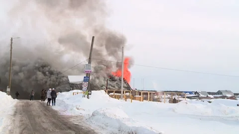 Fire in the village in winter Stock Footage 87540999