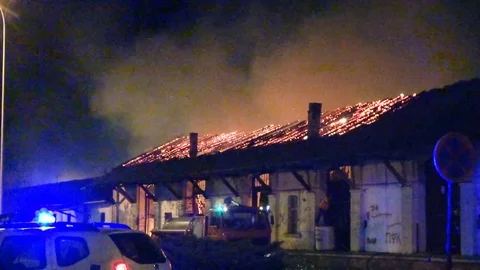 A fire in a warehouse at night Stockbeeldmateriaal 75528022